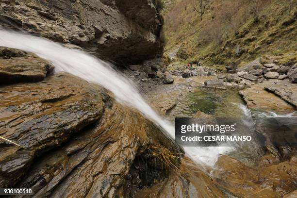 Water flows from the Salto del Nervion waterfall near Berberana in the Spanish province of Burgos on March 10, 2018. The drought-prone region has...