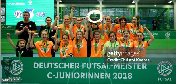 Anouk Blaschka of Hoffenheim lifts the winning trophy on the podium after the the final match between TSG 1899 Hoffenheim and DFC Westsachen Zwickau...