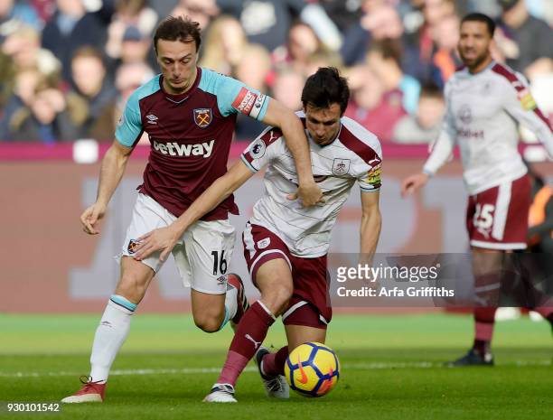 Mark Noble of West Ham United in action with Jack Cork of Burnley during the Premier League match between West Ham United and Burnley at London...