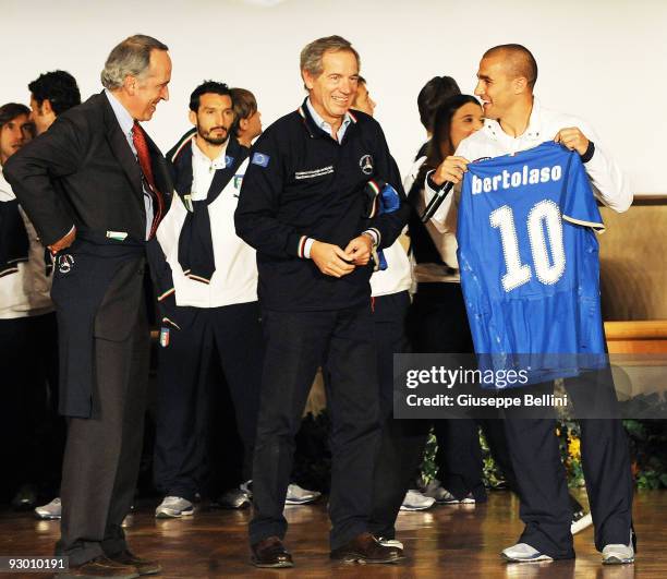 Giancarlo Abete the President of FIGC, Guido Bertolaso and Fabio Cannavaro speak during the Italy national soccer team visit to earthquake striken...