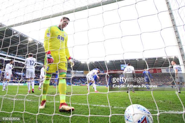 TDavid Stockdale of Birmingham City looks dejected as Craig Bryson of Cardiff City celebrates scoring his sides second goal of the match during he...