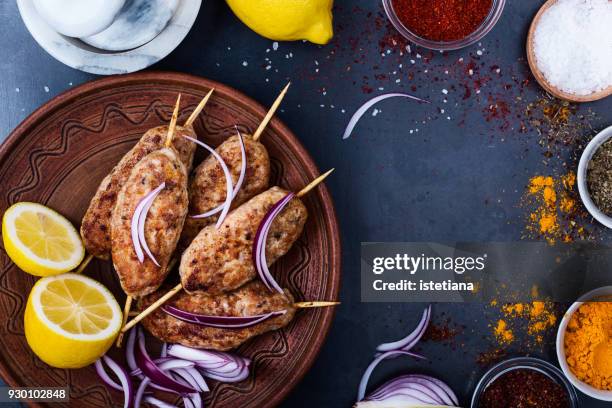 minced chicken meat kebab on ceramic plate, healthy meal - griekse-gerechten stockfoto's en -beelden