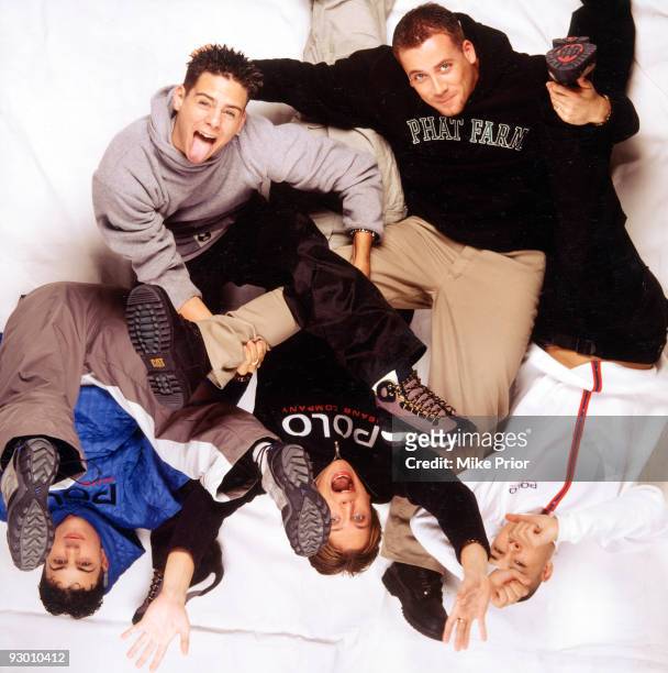 Richard 'Abs' Brown, Scott Robinson, Ritchie Neville, Jason J Brown and Sean Conlon of the boy band 5ive pose for a studio group portrait c 1998 in...