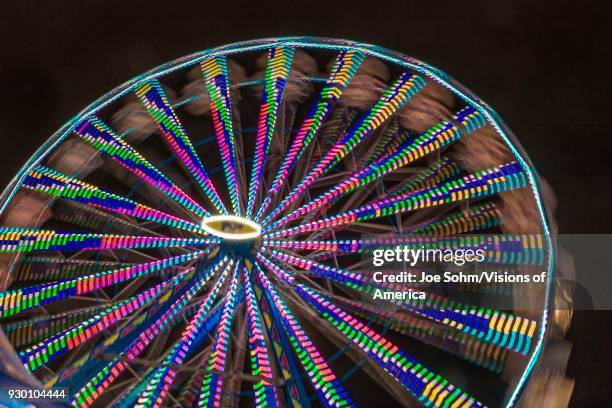 Illuminated Ferris wheel with neon lights at the Ventura County Fair, Ventura, California.