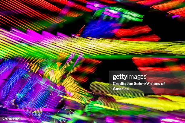 Abstract view of neon Ferris wheel at the Ventura County Fair, Ventura, California.