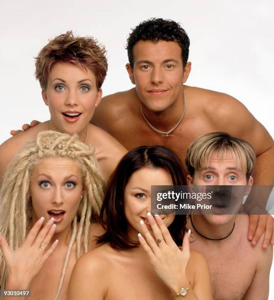 Claire Richards, Lee Latchford-Evans; Faye Tozer, Lisa Scott-Lee and Ian 'H' Watkins of pop band Steps pose for a studio group portrait session in...