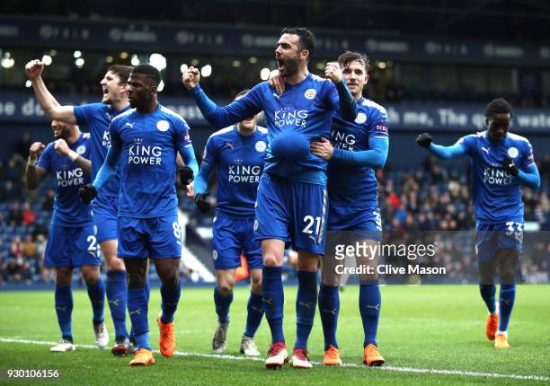 Vicente Iborra of Leicester City celebrates after scoring his sides fourth goal with his Leicester City team mates during the Premier League match...