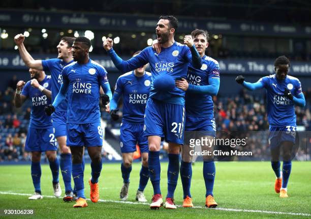 Vicente Iborra of Leicester City celebrates after scoring his sides fourth goal with his Leicester City team mates during the Premier League match...