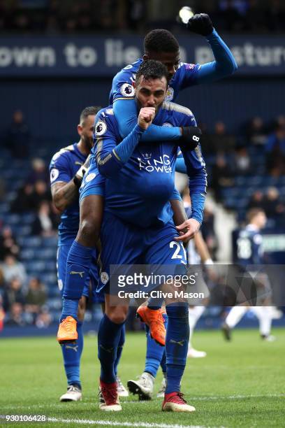 Vicente Iborra of Leicester City celebrates after scoring his sides fourth goal with Kelechi Iheanacho of Leicester City during the Premier League...