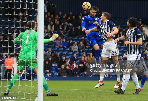 Leicester City's Spanish midfielder Vicente Iborra heads the ball to scores his team's fourth goal during the English Premier League football match...