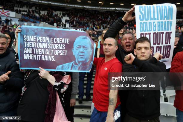 West Ham United fasn hold up protests signs and banners during the Premier League match between West Ham United and Burnley at London Stadium on...