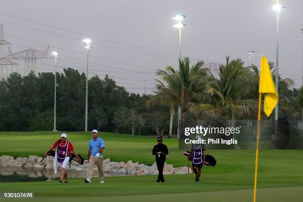 Thaworn Wiratchant of Thailand and Clark Dennis of United States in action during the playoff after the final round of the Sharjah Senior Golf...