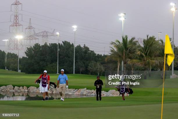 Thaworn Wiratchant of Thailand and Clark Dennis of United States in action during the playoff after the final round of the Sharjah Senior Golf...