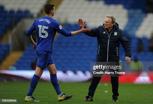 Greg Halford of Cardiff City and Neil Warnock, Manager of Cardiff City celebrate victory during the Sky Bet Championship match between Cardiff City...