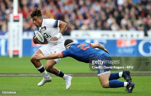 Anthony Watson of England is tackled by Guilhem Guirado of France during the NatWest Six Nations match between France and England at Stade de France...
