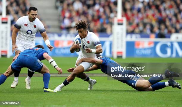 Anthony Watson of England is tackled by Guilhem Guirado of France during the NatWest Six Nations match between France and England at Stade de France...