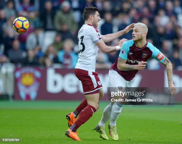 Marko Arnautovic of West Ham United in action with Stephen Ward of Burnley during the Premier League match between West Ham United and Burnley at...