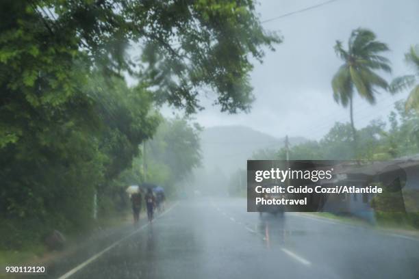 rain along a6 road - three wheeled vehicle stock pictures, royalty-free photos & images