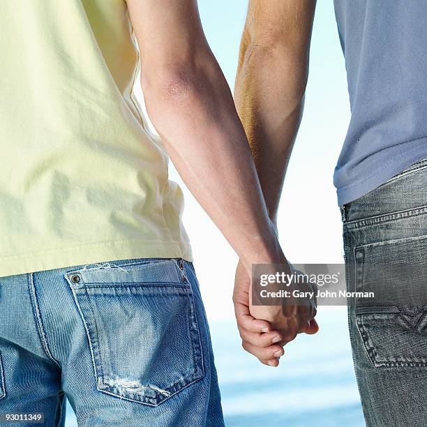 male couple enjoy intimate time together - gary bond stock pictures, royalty-free photos & images