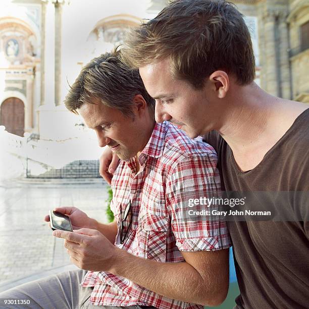 male couple enjoy time together. - gary bond stock pictures, royalty-free photos & images