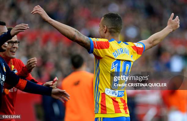 Valencia's Spanish forward Rodrigo Moreno celebrates after scoring a goal during the Spanish league football match between Sevilla FC and Valencia CF...