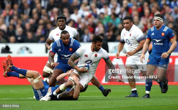 Courtney Lawes of England is tackled during the NatWest Six Nations match between France and England at Stade de France on March 10, 2018 in Paris,...