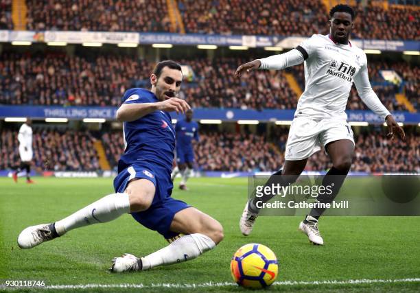 Davide Zappacosta of Chelsea clears the ball while under pressure from Jeffrey Schlupp of Crystal Palace during the Premier League match between...