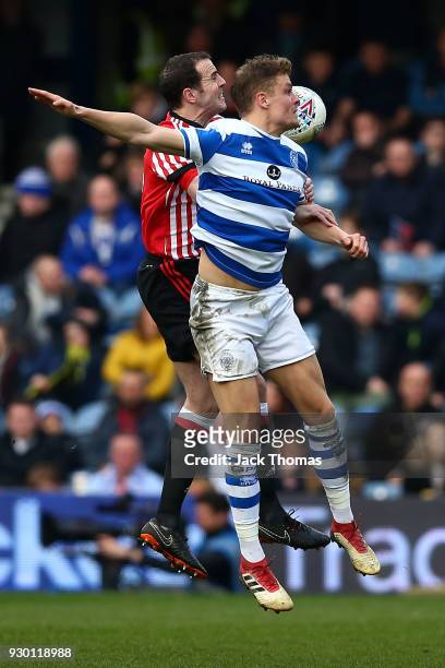John O'Shea of Sunderland and Matt Smith of QPR in action during the Sky Bet Championship match between QPR and Sunderland at Loftus Road on March...