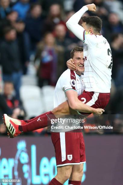 Chris Wood of Burnley celebrates scoring their 2nd goal with Matthew Lowton of Burnley during the Premier League match between West Ham United and...