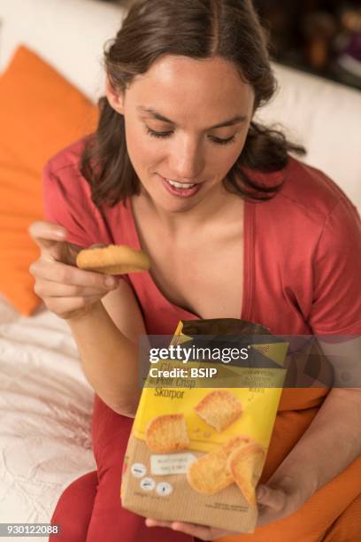 Woman eating gluten-free crisp bread.