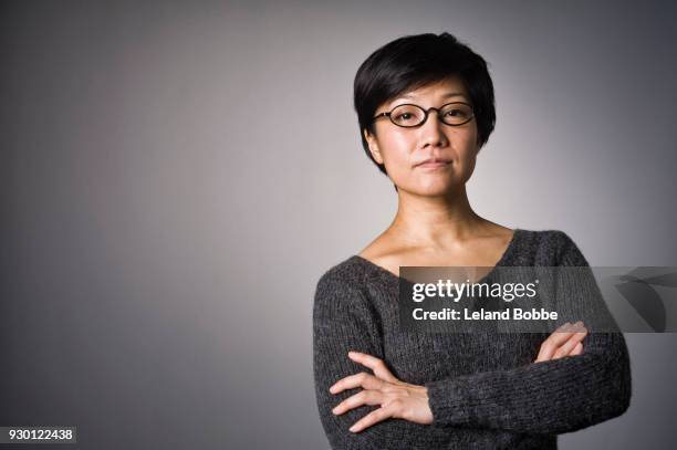 portrait of japanese woman with short hair - woman short hair serious stock pictures, royalty-free photos & images