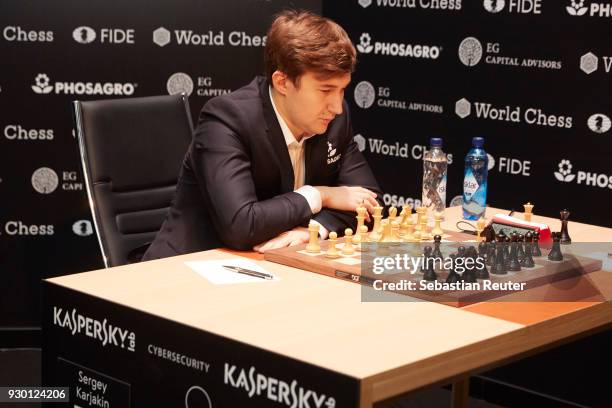 Sergei Karjakin is seen playing the first round at the First Move Ceremony during the World Chess Tournament on March 10, 2018 in Berlin, Germany.