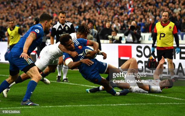 Anthony Watson of England tackles Benjamin Fall of France and is later yellow carded for this incident and a penalty try is awarded to France during...