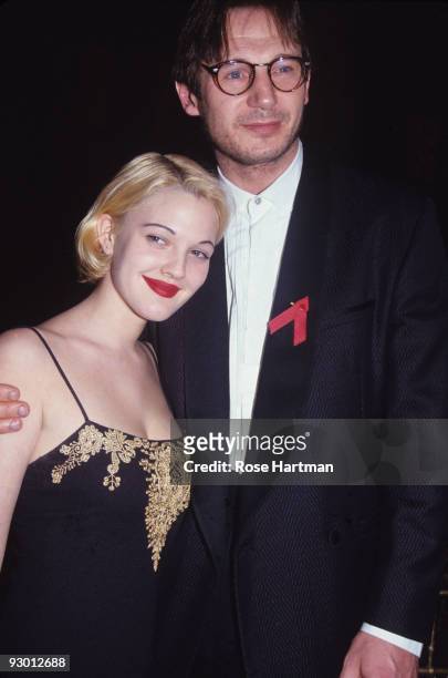Irish actor Liam Neeson and American actress Drew Barrymore pose together at the 12th Annual Council of Fashion Designers of America awards ceremony...