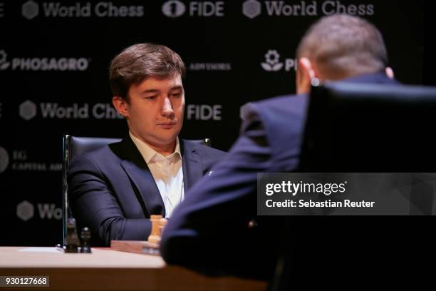 Sergei Karjakin is seen playing the first round at the First Move Ceremony during the World Chess Tournament on March 10, 2018 in Berlin, Germany.