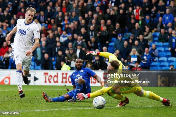 Junior Hoilett of Cardiff City has a shot on goal which rolls past David Stockdale of Birmingham City during the Sky Bet Championship match between...