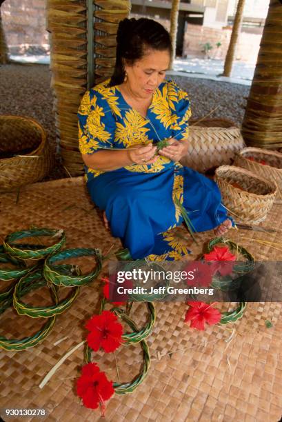 Samoan woman weaving traditional crafts at the Polynesian Cultural Center, Oahu, Hawaii.