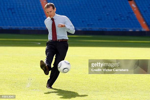 Emilio Butragueno kicks a ball during a visit of the the Jonas Brothers as guests of Real Madrid as they visit Santiago Bernabeu on November 12, 2009...