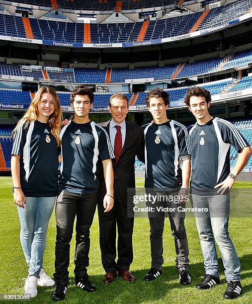 Andrea Guasch of the Disney Channel Spain, Joe Jonas, Nick Jonas, Emilio Butragueno and Kevin Jonas pose during a visit of the Jonas Brothers as...