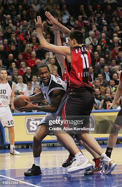 Lawrence Roberts, #4 of Partizan Belgrade competes with Milko Bjelica, #11 of Lietuvos Rytas in action during the Euroleague Basketball Regular...