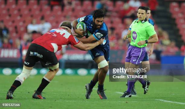 Lions Andries Ferreira tackles Blues Akira Ioane during the Super XV rugby union match between Lions and Blues at Ellis Park Rugby Stadium in...