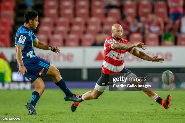 Stephen Perofeta of the Blues and Lionel Mapoe of the Lions during the Super Rugby match between Emirates Lions and Blues at Emirates Airline Park on...