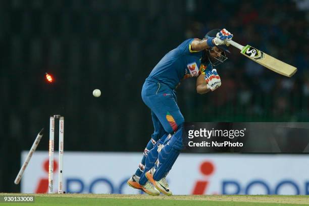 Sri Lankan cricketer Danushka Gunathilaka is bowled out during the 3rd T20 cricket match of NIDAHAS Trophy between Sri Lanka and Bangladesh at R...
