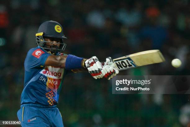 Sri Lankan cricketer Kusal Perera plays a shot during the 3rd T20 cricket match of NIDAHAS Trophy between Sri Lanka and Bangladesh at R Premadasa...