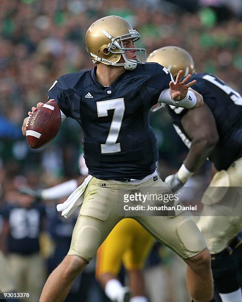 Jimmy Clausen of the Notre Dame Fighting Irish looks for a receiver against the USC Trojans at Notre Dame Stadium on October 17, 2009 in South Bend,...