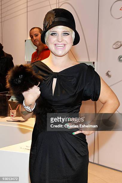 Dancing with the Stars' Kelly Osbourne and her new dog, Sid attend the Swatch Brand re-launch at the Swatch Store Times Square on November 12, 2009...