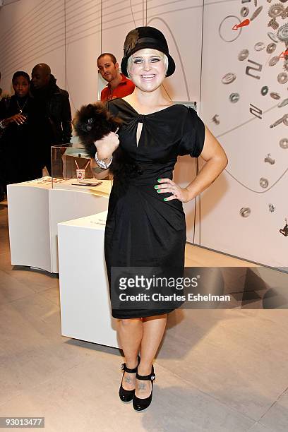 Dancing with the Stars' Kelly Osbourne and her new Pomeranian dog, Sid attend the Swatch Brand re-launch at the Swatch Store Times Square on November...