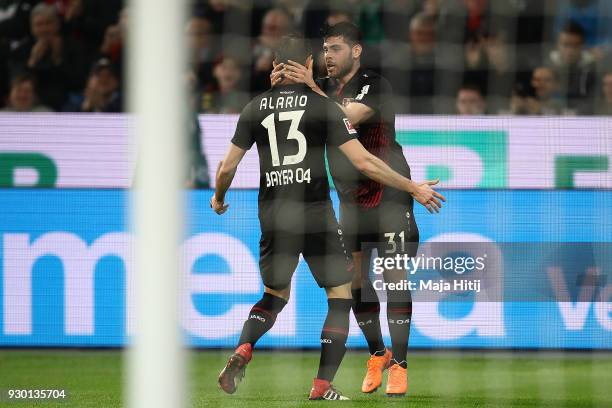 Lucas Alario of Leverkusen celebrates with Kevin Volland of Bayer Leverkusen after he scored a goal to make it 1:0 during the Bundesliga match...
