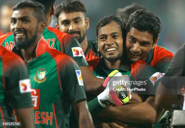 Bangladesh cricket captain Mahmudullah Riyad hugs Mushfiqur Rahim after winning the 3rd T20 cricket match of NIDAHAS Trophy between Sri Lanka and...