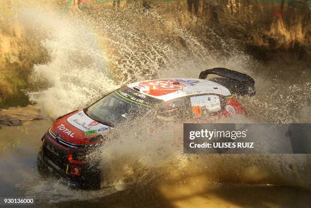 British Kris Meeke and co-driver Irish Paul Nagle steer their Citroen C3 during the second day of the 2018 FIA World Rally Championship in Leon,...